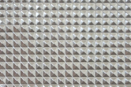 A close up shot of a metal background imprint