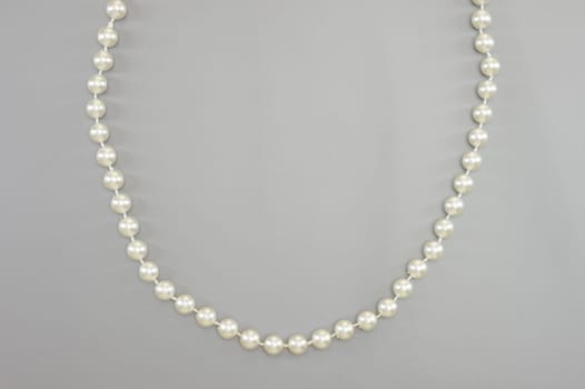 A close up shot of a pearl necklace