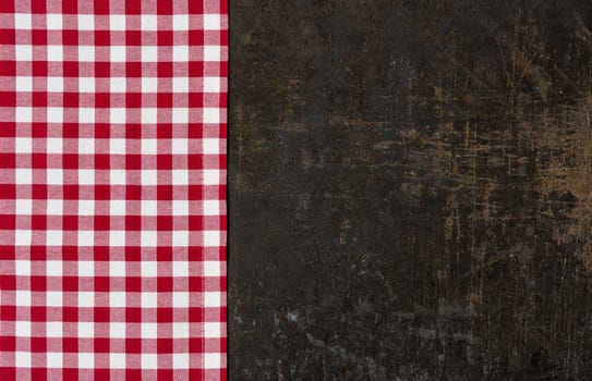 Antique baking tray with a red checkered tablecloth