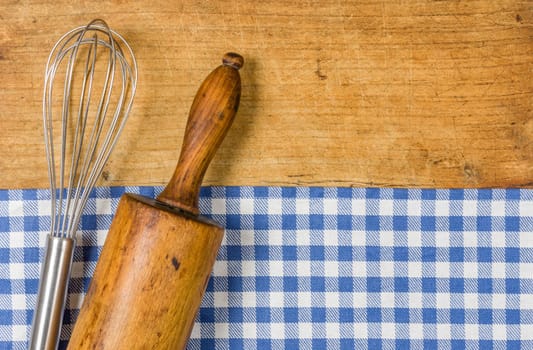 Whiskers and rolling pinons on wooden backgrounds