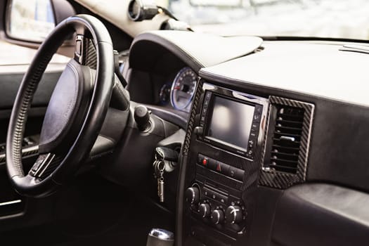 Steering wheel and dashboard in interior of the sports car