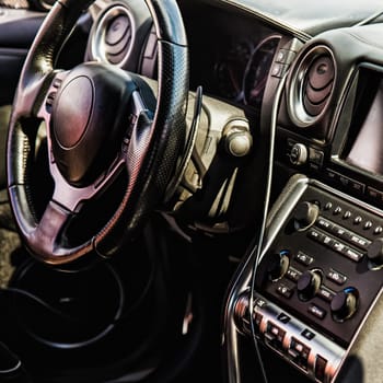 Steering wheel and dashboard in interior of the sports car