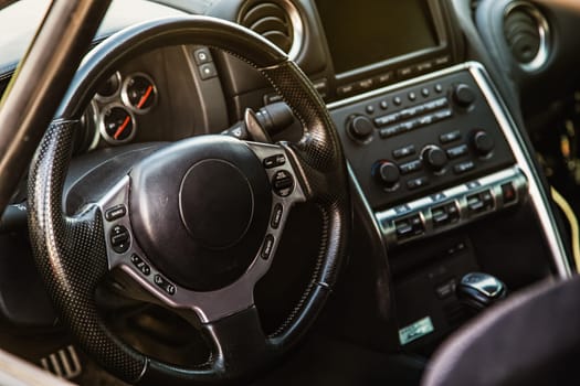 Steering wheel in interior of the sports car