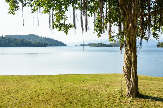 Landscaped lawns for relaxing waterfront under the tree at Kaeng Kra Chan National Park in Phetchaburi Province, Thailand