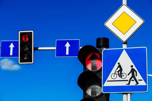Traffic lights over blue sky