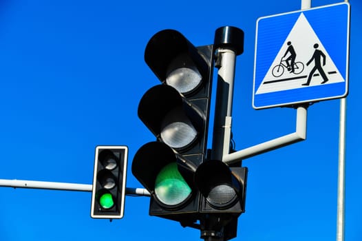 Traffic lights over blue sky