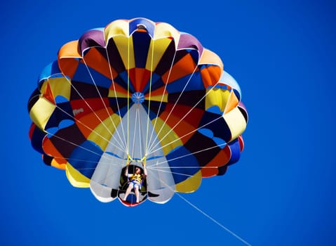 Parasailing over the blue sky