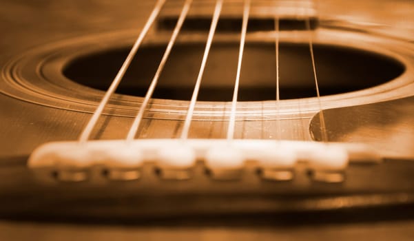Closeup view of an acoustic guitar.