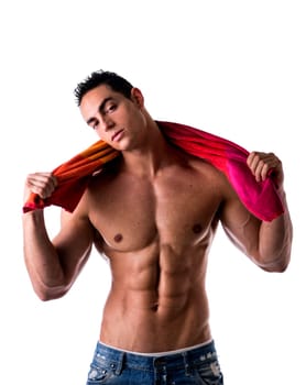 Hunky male model drying himself with a red towel on white background