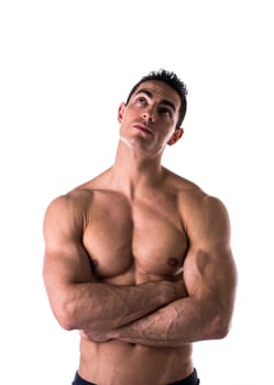 Shirtless man thinking while looking far away on white background
