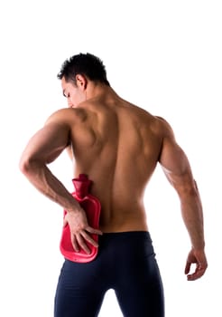 Back of young man with hip or kidney pain, holding hot water bottle, isolated on white