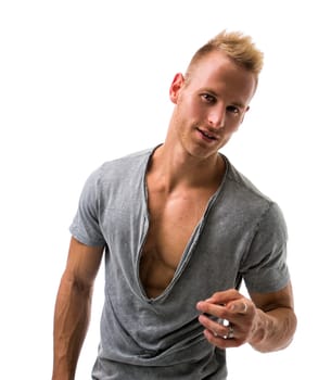 Fit male model with a lot of confidence smiling and pointing on white background
