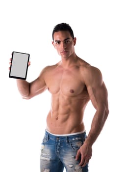 Sexy muscular shirtless young man holding a blank tablet PC while looking at camera, portrait on white