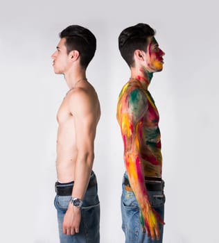 Two Topless Men Standing Back to Back, one with Body Paint Color