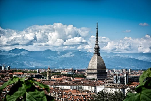 Panoramic view of Turin city center, in Italy, in a sunny day, with Mole Antonelliana and Alps in the background