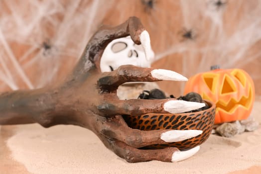 Halloween witch hand and Jack O' lantern pumpkin ornament
