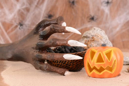 Halloween witch hand and Jack O' lantern pumpkin ornament