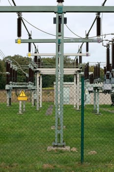 The photograph of a power technology system with high-voltage transformers.