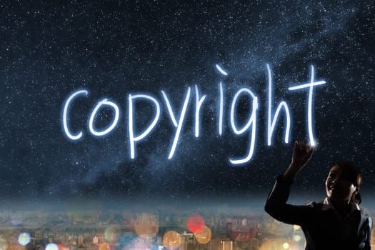 Concept of copyright, silhouette asian business woman light drawing.