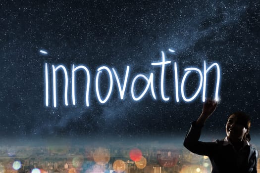 Concept of innovation, silhouette asian business woman light drawing.