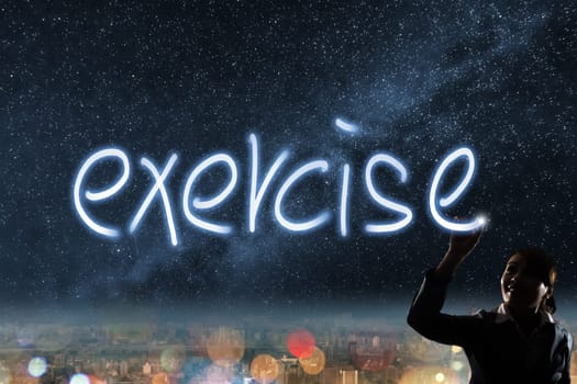 Concept of exercise, silhouette asian business woman light drawing.