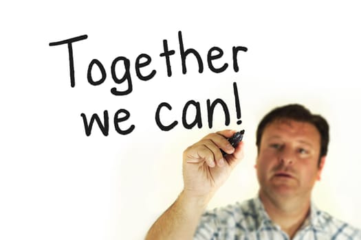 A person writing and pointing "Toginger we can"""