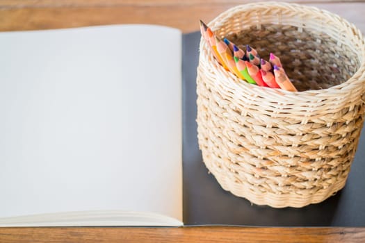 Artist sketchbook and colored pencils, stock photo