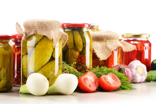 Composition with jars of pickled vegetables. Marinated food