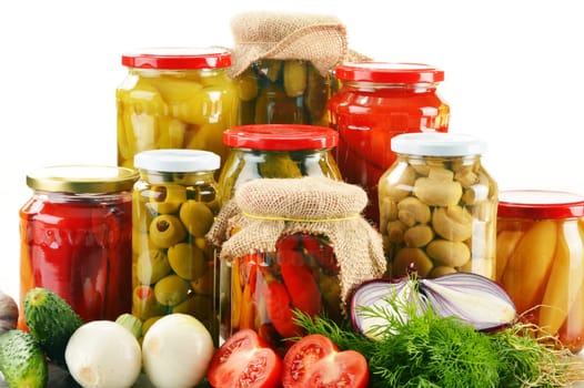 Composition with jars of pickled vegetables. Marinated food