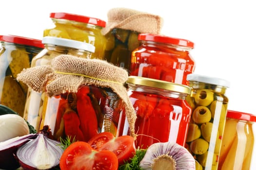 Composition with jars of pickled vegetables. Marinated food