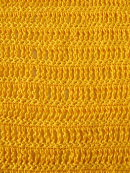 Crochet pattern of triple rods and solid stitches in yellow