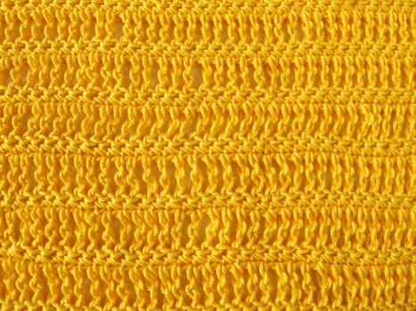 Crochet pattern of triple rods and solid stitches in yellow