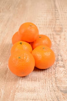 Fresh tangerines on a wooden table