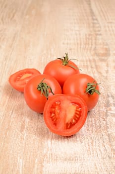Fresh tomatoes on a wooden table