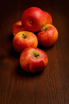 Fresh apples on a rustic wooden table