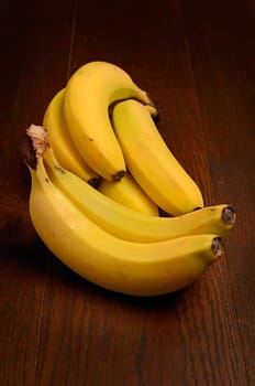 Organic bananas on a rustic wooden background