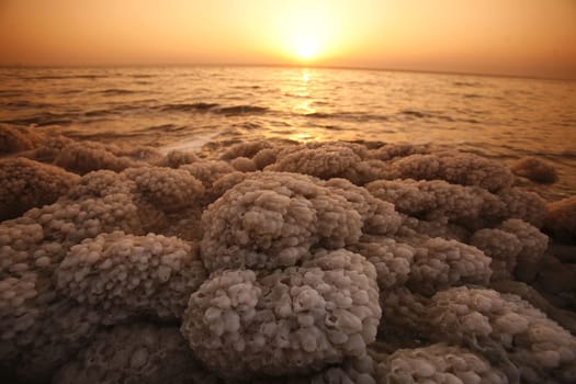 The coast with natural salt of the death sea neat the Village of Mazraa in Jordan in the middle east.