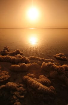 The coast with natural salt of the death sea neat the Village of Mazraa in Jordan in the middle east.