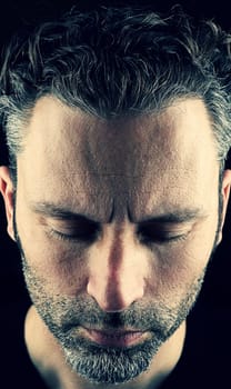 Thinking man with closed eyes