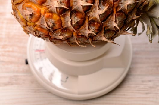 Pine apple on a scale