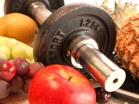 Fresh fruits with sports equipment