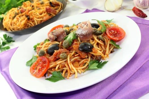 Capellini with tomatoes,anchovies,capers and olives