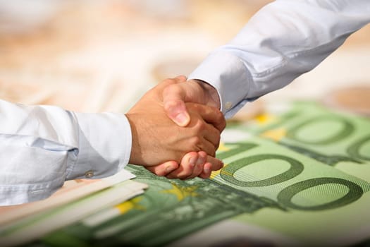 Handshake and Euro Banknotes Background