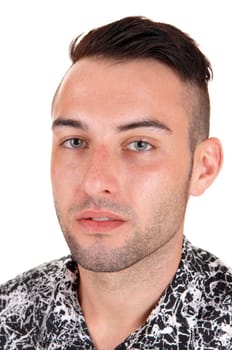 A closeup picture of a young Caucasian man with short black hair, looking.into the camera, isolated on white background..