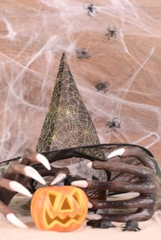 Halloween witch hands and hat close-up
