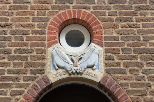 ancient facade ornamentation of two goats in deventer, netherlands