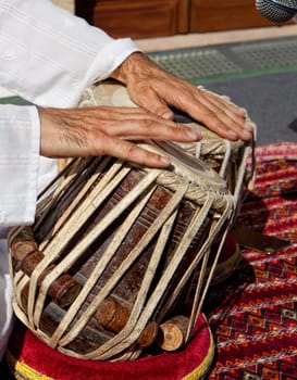 Man playing on traditional indian tabla drums. Closeup view