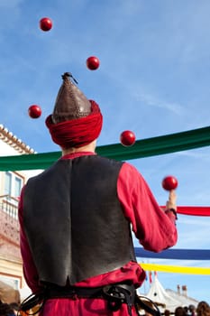 Performer juggling during the Almossassa Culture Festival of Marvao, Portugal