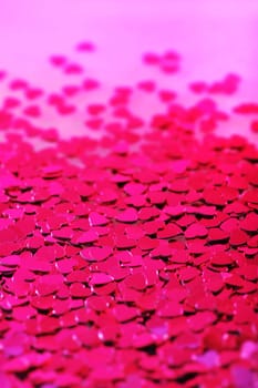 Detailed view of many small pink glitter hearts
