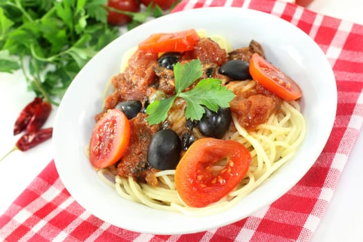 Capellini with tomatoes,anchovies,capers and olives